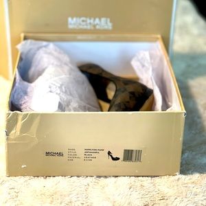 Michael Kors Brown with signature MK and gold hardware on back. Size 6.5.